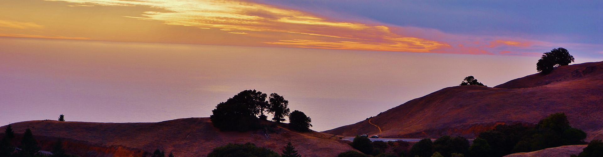 Sunset over seaside hills