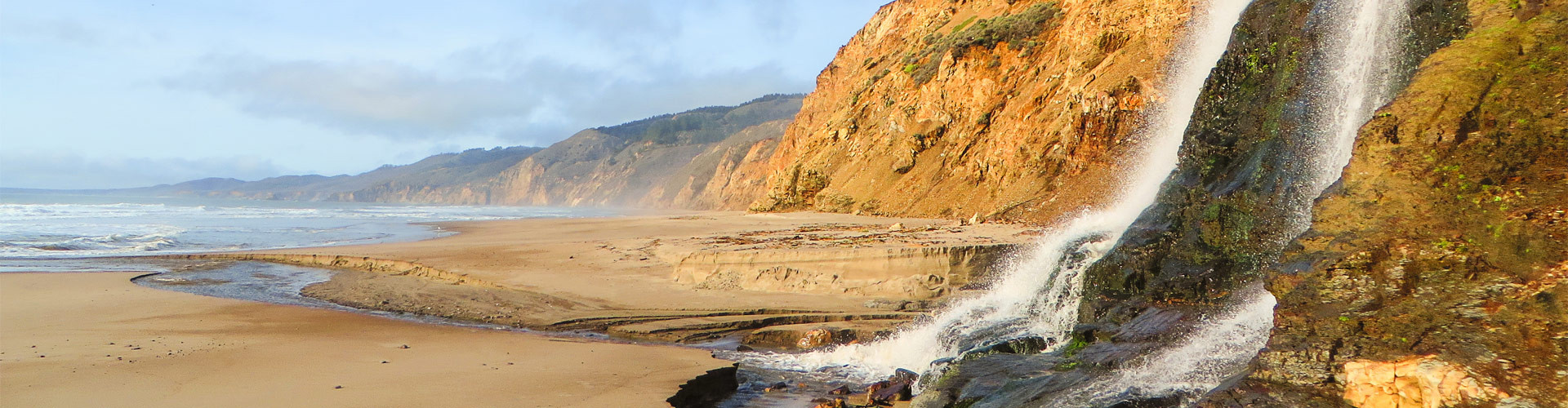 Pacific beach with waterfall photo